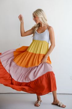 You'll always get compliments on your summer style when you wear the Compelling Aesthetic Color Block Maxi Dress! Crafted from lightweight, flowing fabric, this maxi dress is as comfortable as it is stylish, making it perfect for both casual and semi-formal occasions. This modern twist on traditional color blocking adds a dynamic and eye-catching element to your ensemble. Designed with tiered layers, the maxi dress offers a graceful silhouette that cascades beautifully with each step. The flowin Flowy Casual Midi Dress For Beach Cover-up, Casual Flowy Midi Dress For Beach Cover-up, Flowy Midi Dress For Spring Beach Cover-up, Flowy Midi-length Summer Beach Dress, Summer Midi-length Beach Dress, Breezy Maxi Dress For Brunch, Breezy Tiered Maxi Dress For Summer, Rayon Maxi Dress For Brunch, Flowy Breezy Long Maxi Dress