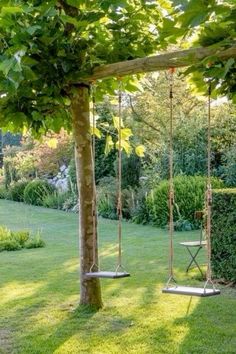 a swing set in the middle of a garden