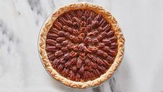 a pecan pie on a marble table