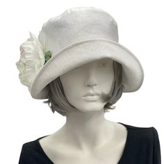 HANDMADE IN THE USAWear this lovely Eleanor cloche hat to a garden party, the horse races, or an afternoon wedding and you’ll appear just as chic as Mary on Downton Abbey in today’s 20s. Meticulously crafted with care, this wider brim linen hat - lined in soft cotton - offers effortless style without sacrificing comfort. Its full head coverage will protect you from the sun on a hot afternoon, and the large peony brooch is an elegant touch. The brooch is removable and can be worn anywhere you cho Bespoke Hats, Afternoon Wedding, Tea Party Hats, Wedding Linens, Cloche Hat, Handmade Hat, Wedding Hats, Wide Brimmed, White Linen