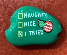 a green rock with an ornament on it that says, naught once tried