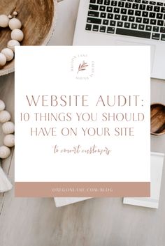 a desk with a laptop, mouse and other items on it that says website audit 10 things you should have on your site