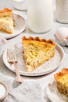 there is a slice of quiche on the plate next to another piece of pie