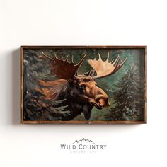 a painting of a moose with large antlers on it's head is mounted to the wall