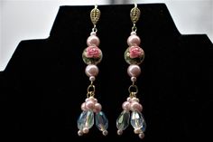 "These, stunning, romantic, Boho, high quality, earrings are wonderful accessories to go with your Spring and Summer fashions ! The unique, style dangles, are wonderful, special occasion accessories done in soft shades of pink ! The earrings are fashioned from a combination of, 8mm, 5mm, and 2mm, soft pink, glass pearls ! The focal points are the beautiful, 12mm, Japanese Tensha beads ! They have wonderfully, detailed pink roses with green leaves on a white background. The Tensha beads are handm Elegant Pink Pearl Drop Beaded Earrings, Elegant Pink Teardrop Beaded Earrings, Wedding Beaded Dangle Flower Earrings, Beaded Dangle Flower Earrings For Wedding, Elegant Teardrop Earrings With Dangling Beads Gift, Elegant Gift Teardrop Earrings With Dangling Beads, Elegant Pink Dangling Beads Earrings, Elegant Pink Flower Earrings With Dangling Beads, Elegant Flower Earrings With Dangling Beads For Wedding