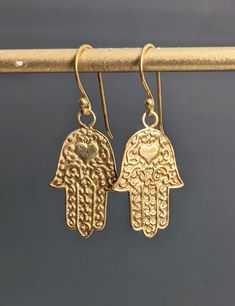 "Bali Gold Hamsa Hand Earrings, 24 K Gold Filled, Zen Yoga Jewelry, Protection, Faith Symbol, Jewelry Gift Charm, Hand Charm Earrings. Pendant size: 16 x 28 mm. Earrings are 1.6\" ( 40 mm. ) * Processing time is 3 - 5 days.  * US orders are shipped first class mail. * International orders are shipped first class international. * Shipping upgrades are available at checkout. Thank you for visiting my listing! Have a wonderful day!" Faith Symbol, Applying Perfume, Symbol Jewelry, Hand Earrings, Zen Yoga, Gold Hamsa, Earrings Pendant, Yoga Jewelry, Hamsa Hand