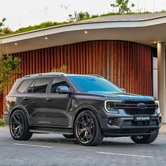 a black truck parked in front of a building