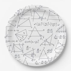 a white plate topped with lots of different types of math notes on it's surface