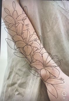 a person with a flower tattoo on their arm