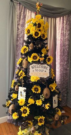 a decorated christmas tree with sunflowers on it