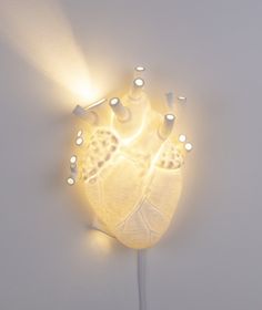 a light that is on the side of a wall with lights coming out of it