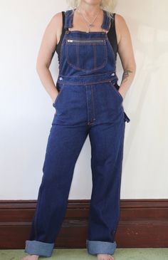 Vintage 1990s dark wash long overalls.  In excellent vintage condition  Fabric: Cotton   Size: 10 Australian  Measurements  Length: 160cm (adjustable) Waist: 78cm Hips: 94cm Rise: 34cm Postage Standard postage $10.00 or Express postage within Australia $13.00. DM for a quote on combined postage, international buyers please email for a quote if postage costs are not specified. Dark Wash Full-length Overalls With Pockets, Dark Wash Full Length Overalls With Pockets, Retro Dark Wash Denim Jumpsuit, Retro Straight Leg Overalls With Pockets, Vintage Dark Wash Bib Front Overalls, Vintage Dark Wash Overalls With Pockets, Retro Dark Wash Bib Front Overalls, Vintage Dark Wash Denim Jumpsuit With Straight Leg, Vintage Dark Wash Straight Leg Denim Jumpsuit