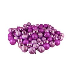 a pile of purple christmas balls on a white background