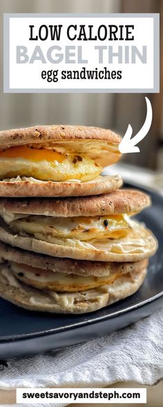 stack of low calorie bagel thin egg sandwiches on a black plate with text overlay reading low calorie bagel thin egg sandwiches