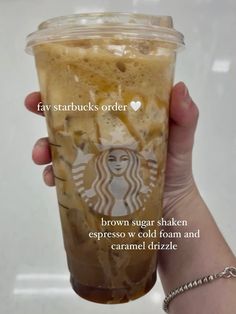 someone holding up a starbucks drink with the caption, brown sugar shakes espresso cold foam and caramel drizzle