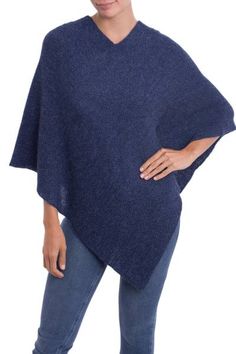 A classic and beautiful design this elegant poncho is presented by artisan Alfredo Falcon of Peru. Indigo in color the soft and warm garment is knit from 100% alpaca wool. Winter Cashmere Poncho One Size, One Size Cashmere Poncho For Fall, Cozy Cashmere Cape, Cozy Knitted Alpaca Poncho, Casual Alpaca Poncho For Fall, Elegant Knit Winter Poncho, Elegant Knit Poncho For Winter, One Size Alpaca Poncho, Cozy Alpaca Shawl