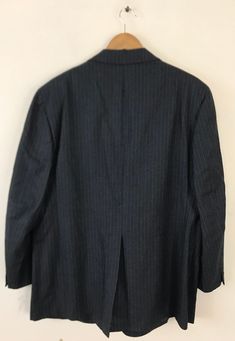 "-Description- >men's dark gray sport coat with light blue pinstripes >two button front >two buttons on the cuffs >three open pockets on the front >vent in the back >partially lined >size 46 >awesome 70s sport coat! >condition: great >color(s): gray, blue >fabric(s): wool >brand: majer >care: dry clean -Measurements- >size: 46 ✩ all measurements are taken with the item laying flat & some sizes are estimates so please check measurements ✩ chest: 46\" Semi-formal Pinstripe Sport Coat With Long Sleeves, Pinstripe Long Sleeve Sport Coat For Semi-formal Occasions, Business Striped Outerwear With Button Closure, Pinstripe Single Breasted Long Sleeve Sport Coat, Pinstripe Single-breasted Long Sleeve Sport Coat, Long Sleeve Pinstripe Single Breasted Sport Coat, Striped Business Outerwear With Pockets, Business Striped Outerwear With Pockets, Semi-formal Striped Long Sleeve Sport Coat