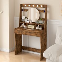 a wooden vanity with lights on it in a living room next to a white couch