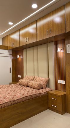 a bed sitting inside of a bedroom on top of a hard wood floor