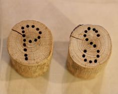 two pieces of wood that have holes in them