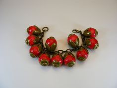 Charm, bracelet, armlet, brass bracelet, red bracelet, hude beads,  floral, arm jewelry, floral beads, gift, wife, girlfriend, birthday  --------------------------- A beautiful red beads with brass beads caps and chain vintage bracelet..It is approx. 7 ½ " (19cm) lenght. It is in very good vintage condition.  For adult use only - embellishments may have small or pointy parts. Actual colors may slightly vary from those shown due to the nature of photographing and monitor color settings. More phot Vintage Large Beads Bracelet Jewelry, Adjustable Red Brass Jewelry, Bohemian Red Flower Bracelets, Vintage Red Bracelet As A Gift, Red Flower Shaped Bracelets For Gifts, Vintage Red Bracelet For Gifts, Brass Bracelets With Round Beads For Gifts, Brass Bracelets With Round Beads As Gift, Red Costume Jewelry Bracelets As Gift