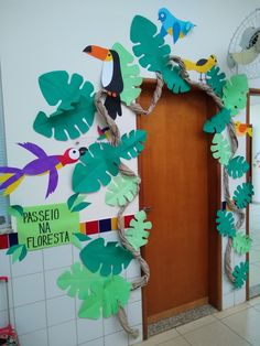 the door is decorated with paper leaves and toucados on it, along with other decorations