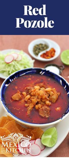 red pozole soup in a bowl with tortilla chips on the side