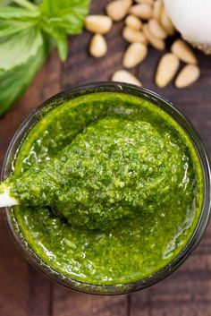 pesto sauce in a glass with a spoon