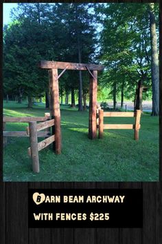 two wooden gates in the grass near some trees and other greenery, with one gate made out of logs