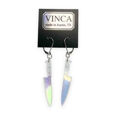 If you're a fan simple yet stunning things then these are the earrings for you. Our Midi 2" Knife Dangle Earrings in transparent iridescent are cut from acrylic. Two inch Hologram Knife charms are on a 1" surgical steel hinged hook. Transparent iridescent acrylic Sold as a pair 2" knife charms on surgical steel hinged hooks Hidden Knives, Iridescent Acrylic, Candle Cards, Body Stickers, Book Candle, Fish Hook Earrings, Shoe Gifts, Polymer Clay Crafts, Fish Hook