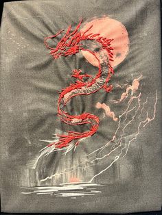 a drawing of a red dragon on a gray background with lightning coming out of it