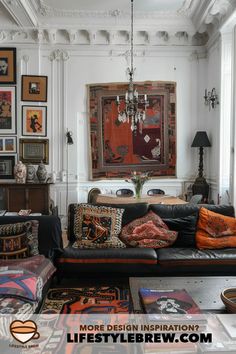 a living room filled with furniture and pictures on the wall