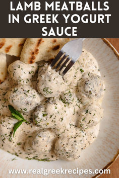 a white plate topped with meatballs and pita bread