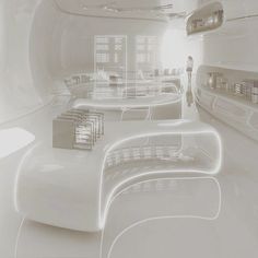 the interior of a futuristic office with white furniture