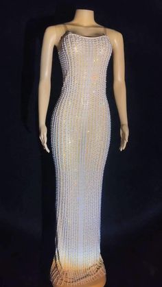 Beautiful Pearl and Gold Rhinestone Maxi Dress. Step out in style in this stunning, custom made, sparkly maxi dress.  Clear adjustable straps  Made to Order - Please allow 3-4 weeks for production. * Sizing - All items are made according to measurement ranges, they are NOT typical letter or numeric sizing. It is imperative to compare your exact measurements with the size chart provided either in the listing photos or item descriptions and to also add your measurements under Personalization. If you have any questions on sizing, please feel free to message me. Do not order your normal size without taking and comparing measurements. * Made to order items such as feather tops, jackets, dresses and rhinestone/crystal dresses are NON-REFUNDABLE/EXCHANGEABLE. If you have a problem with your order Sparkly Maxi Dress, Fancy Christmas Party, Crystal Dress, Feather Jacket, Feather Tops, Velvet Maxi Dress, Feather Dress, Gold Rhinestone, Dress Clothes For Women