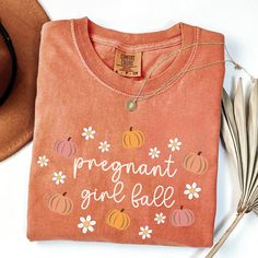 The perfect fall pregnancy shirt! COMFORT COLORS 1717 UNISEX SHIRT One of the most popular t-shirts on the market.  Extremely soft and 100% ring-spun cotton The fabric has been meticulously garment-dyed using the signature Comfort Colors process, resulting in rich, vibrant colors that are designed to fade gracefully over time, adding to the shirt's unique character and vintage appeal.  SIZING Tees are a UNISEX, relaxed fit. Please refer to the size chart in the listing photos for details. Easy measuring tip: Take your favorite tee, lay it on a flat surface, and measure the width (armpit to armpit) and the length (top to bottom) YOU HAVE TO SIZE UP (RECOMMENDED 2 SIZES) FOR OVERSIZED LOOK PROCESSING + SHIPPING Production time: 1-3 days Shipping: 2-5 days  All items are made to order. They w Pink Cotton Maternity Top, Pregnant Girl, Fall Pregnancy, Maternity Shirts, Mommy To Be, Fall Maternity, Mommy Shirts, Maternity Outfits, Maternity Shirt