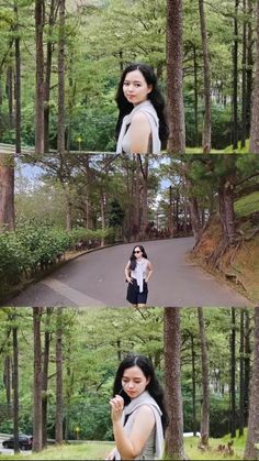 a woman standing in the middle of a forest