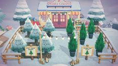 a snowy scene with trees and signs in front of a building that says nick's candy