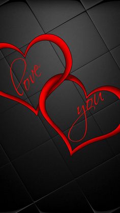 two red hearts with the words love you written on them in cursive writing