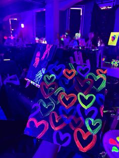 neon hearts are on display at an event