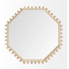 a round mirror with beaded edges on a white wall, reflecting the light from above