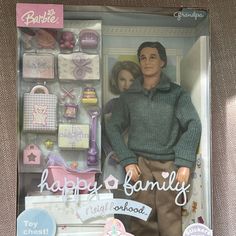 a barbie doll with a man and woman in a box