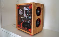 a wooden case with speakers on top of it