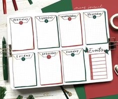 a planner with the words monday and friday written on it, surrounded by christmas decorations