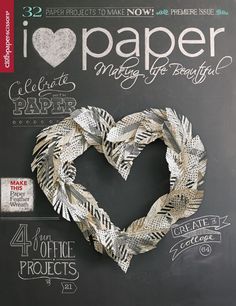 the cover of i love paper magazine with a heart made out of feathers on it