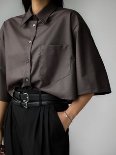 Longer length half sleeve button through shirt with large front chest pocket. High neck collar line. Model is in MINUSEY ONE SIZE. ✔️ Free worldwide express shipping over $100✔️ Loved by 6,500+ customers✔️ Limited edition collections, maximum styleStay ahead of the trend with can’t-find-anywhere-else staples. Your closet will thank you 💕 * MINUSEY ONE SIZE = EU 34-38, US 2-6* 5% Wool / 18% Rayon / 75% Tencel / 2% Spandex* Dry clean* Made in Korea - Model Height: 172cm/5'7" (US2, EU34) Homecoming Outfits Gender Neutral, Female Button Up Outfits, Fancy Gender Neutral Outfits, Nonbinary Homecoming Outfit, Relaxed Fit Shirt With Pockets And Collar, Brown Short Sleeve Workwear Shirt, Collared Tops With Pockets For Office, Relaxed Fit Shirt With Collar And Pockets, Office Wear Short Sleeve Shirt