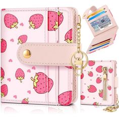 a pink wallet with a chain attached to it and a card case next to it