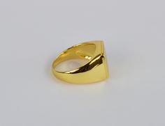 This listing is for 14k Gold Filled signet ring the base metal is 925 sterling silver. this is a timeless classic that goes with just about any look and will look great both on man and woman. What is Gold Fill? It's an actual layer of gold-pressure bonded to another metal. Gold filled is not to be confused with gold plating as filled literally has 100% more gold than gold plating. Gold filled is much more valuable and tarnish resistant. It does not flake off, rub off or turn colors. As a matter Classic Gold Enamel Promise Ring, Modern Gold Enamel Ring With Polished Finish, Classic Gold Open Enamel Ring, Modern Gold Enamel Ring For Gift, Gold Enamel Promise Ring With Polished Finish, Classic Enamel Ring With Polished Finish As A Gift, Classic Polished Enamel Ring For Gift, Classic Enamel Ring With Polished Finish, Shiny Finish Round Band Rings For Gift