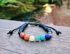 Adjustable Boho-Style 3-in-1 Aromatherapy Chakra and Shungite Bracelet - Three-in-One: EMF protection, Chakra stones, and Aromatherapy - what more could you ask for!? This trendy chakra bracelet is perfect for all ages and genders and includes REAL GENUINE chakra stones, not imitation (colored beads) like most others. And, as a bonus, our signature Boho-Style Chakra bracelet has authentic SHUNGITE and ONLY available from Karelia Creations! This bracelet uses 8mm beads and a long-lasting nylon co Black Holistic Beaded Bracelets With Natural Stones, Holistic Black Beaded Bracelet With Natural Stones, Adjustable Black Holistic Bracelets, Handmade Black Holistic Bracelets, Holistic Black Handmade Bracelets, Holistic Handmade Black Bracelets, Handmade Holistic Black Beaded Bracelets, Handmade Black Beaded Bracelets, Shungite Bracelet