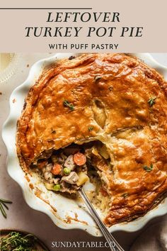 a turkey pot pie on a plate with a fork in it and the title overlay reads, leftover turkey pot pie with puff pastry